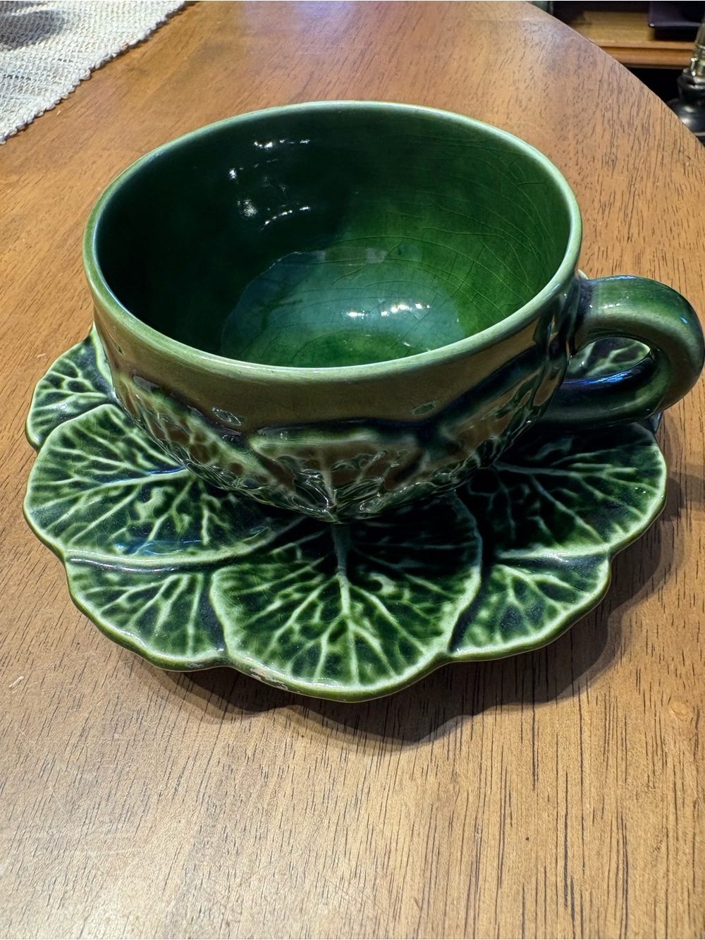 Bordallo dark green cabbage tea cup and saucer. Made in Portugal